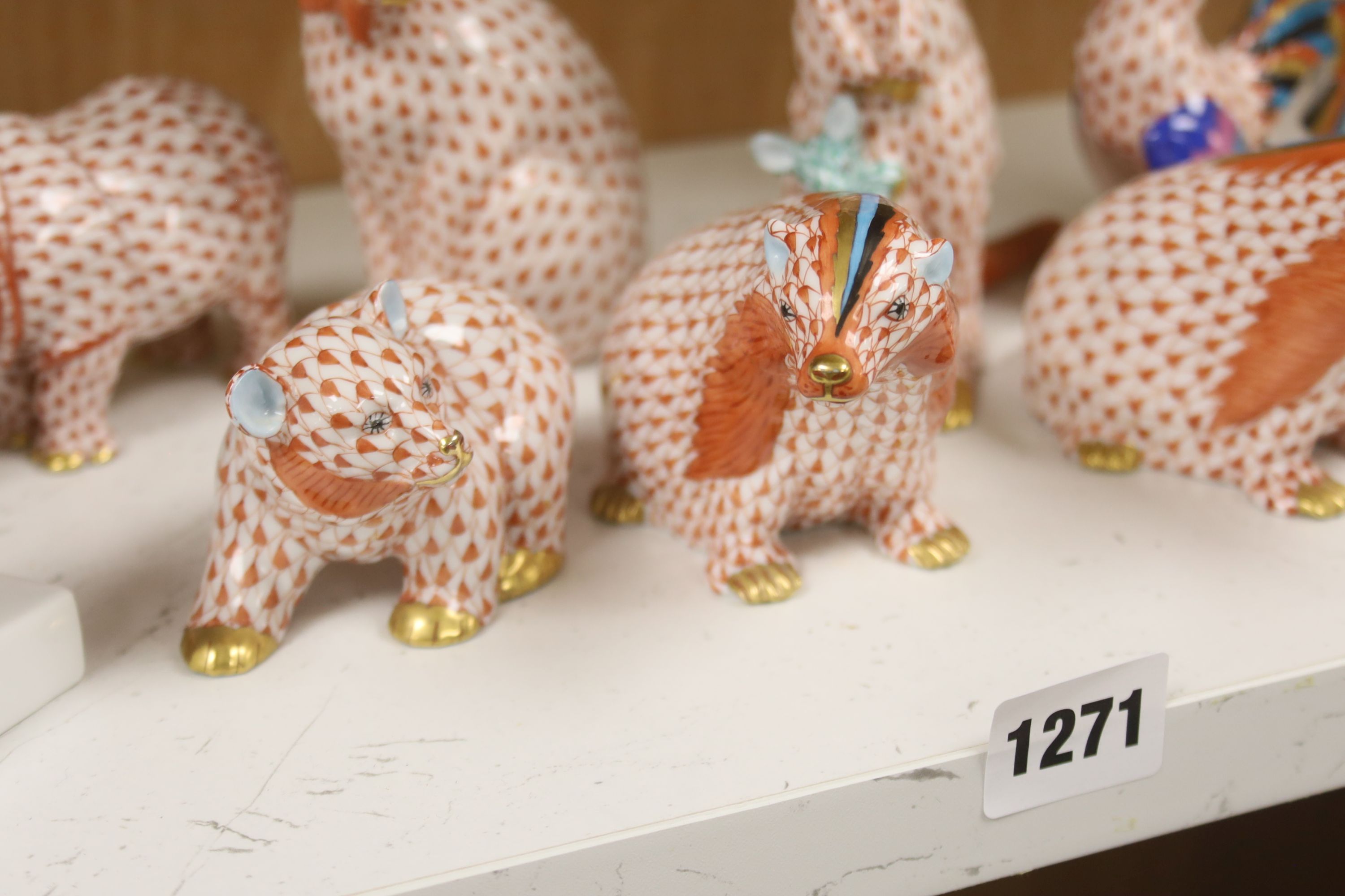 Nine Herend red ‘fishnet’ porcelain animal and bird figures,